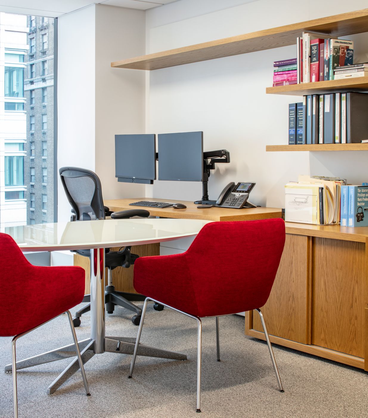 NEW MILLENNIA offices feature White Oak veneer with Sessions elliptical tables in Polished Chrome and White Glass.